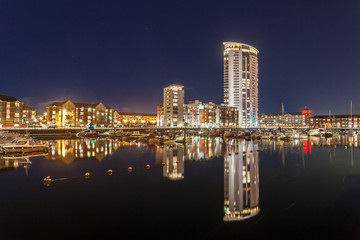 Fototapeta na wymiar SWANSEA, UK - FEBRUARY 18, 2016: Swansea Marina, featuring the tallest building in Wales, the Meridian tower, standing at 107m (351ft). 
