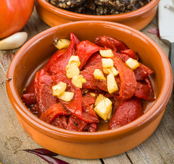 fried peppers and sausage served on wooden
