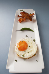 Breakfast. Fried eggs and fried bacon..