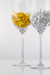 Two glasses of wine and golf equipments