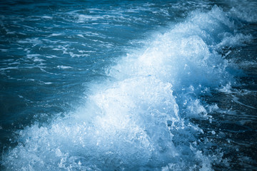 Obraz na płótnie Canvas Wave on the pebble coast of sea. Selective focus. Toned