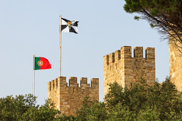 Flags on top of Castle Sao Jorge in Lisbon, Portugal