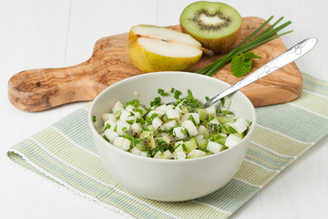 Homemade Salsa Made Of Kiwi, Pears, Chives And Mint. Olive Wood