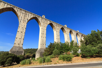 Beautiful view of the Aguas Livres Aqueduct on a summer day in Lisbon, Portugal