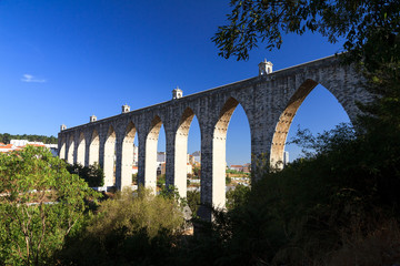 Beautiful view of the Aguas Livres Aqueduct on a summer day in Lisbon, Portugal