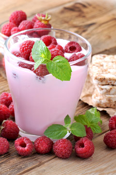 Delicious fresh youghurt with raspberry.