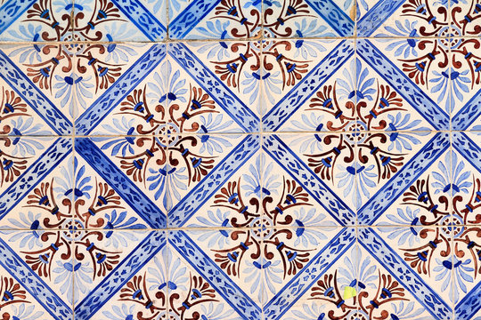 Close up image of the beautifully decorated tiles on the houses in the streets of Lisbon, Portugal