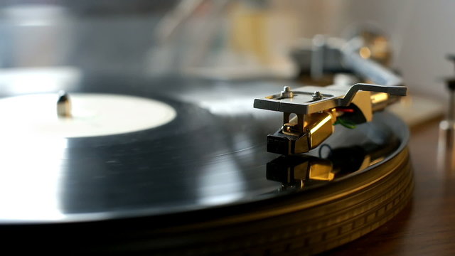 Turntable with spinning vinyl records
