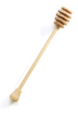 wooden honey stick on white