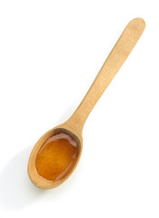 wooden spoon and honey on white