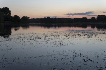 the beautiful embankment of the lake in the twilight of day