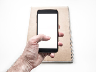 Hand holding and using mobile smartphone mockup