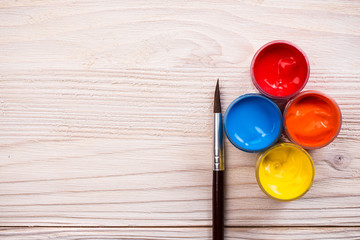 Various color paints with brown brush