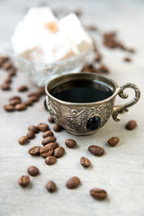 Coffee in silver vintage cups on wooden background