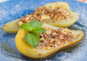 Pear baked with honey, curd cheese and walnuts