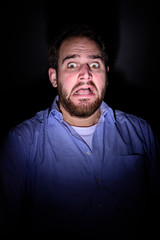 Scared face in the dark