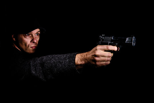 Man with gun aiming
