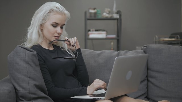 Beautiful Blonde Girl Chat with Laptop and Smile