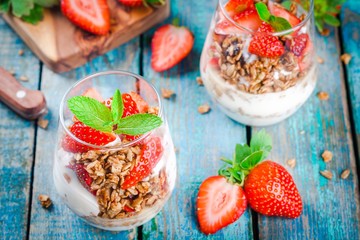 Homemade granola parfait with strawberry and mint.