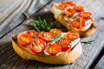 Sandwich of toasted bread mozzarella and cherry tomatoes