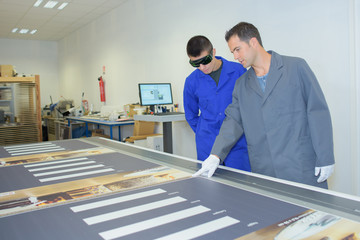 Man in printers wearing protective glasses