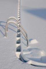Snowy swimming pool stairs