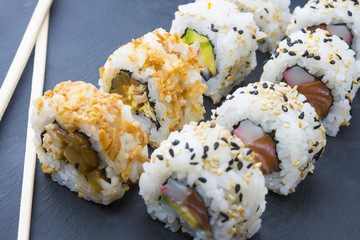 Sushi rolls on a slate plate