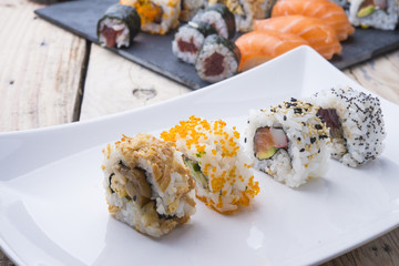 Salmon and caviar rolls served on a plate