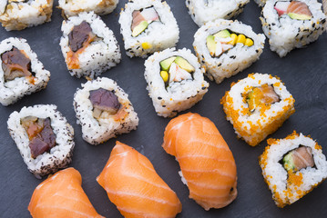 Sushi rolls on a slate plate