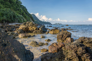 Fototapeta na wymiar Rocks in Red Island beach, Banyuwangi, East java, Indonesia
