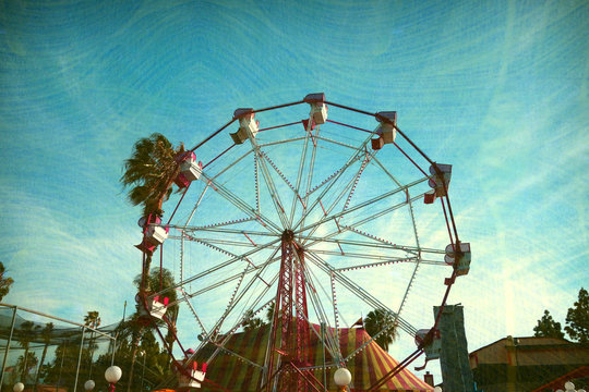 aged and worn vintage photo of ferris wheel