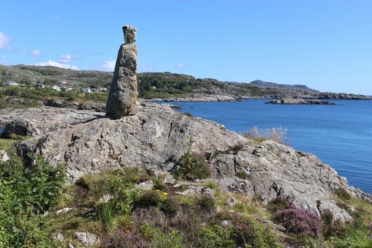Southwest Norway, Europe, near Eigeroy. stone sculpture in a coastal landscape with many small islands, reefs and skerries. 