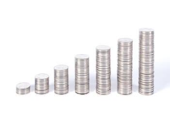 seven coins towers increasing as a graph isolated on white background. seven coins stacks referring to days in week.