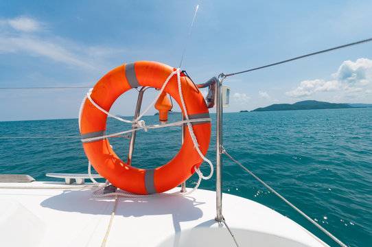 Orange lifebuoy on the yachts preparing for a safety