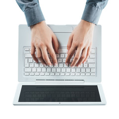 Fototapeta na wymiar Blogger typing on a laptop