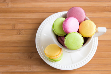 Some macaroons at white tea cup