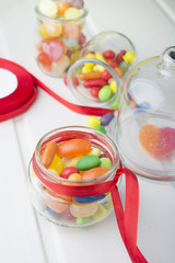 Multicolor candies in glass jars