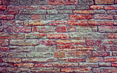 Old brick wall.  Apply color and lighting effects. Colorful picture. Deep, rich, bright colors.  Vignetting. Art reception.