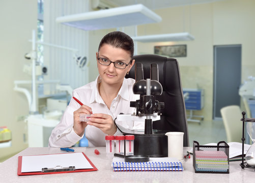 woman studying a sample