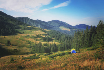 Morning in the mountains. Camping in tents in Carpathian Mountains 