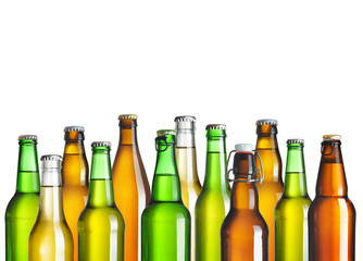 Collection of beer bottles without labels isolated on white