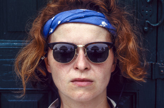 red hair woman with sunglasses