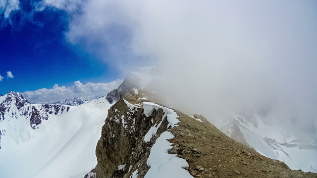 Timelapse.  Cloudy at the top of the ridge mountain Sairam-Su