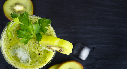 Green smoothie with kiwi and parsley. Empty space for text.