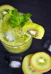 Fototapeta na wymiar Green smoothie with kiwi and parsley