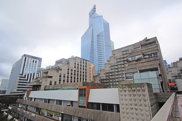 Fototapeta na wymiar Defense, Paris, France, February 9, 2016: sky-scrapers in a Paris district Defense. Because of it's modern .architecture this district is called the Paris Manhattan