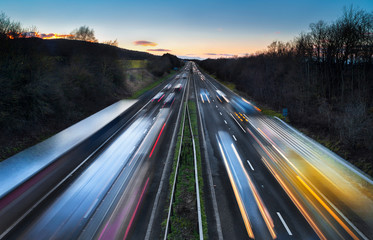 Light Trails of Fast Moving Cars on Busy Motorway at Dusk © S11RF