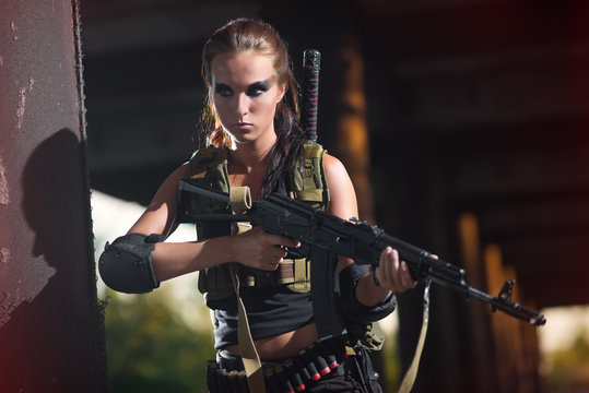 sexy military armed girl with the weapon, sniper