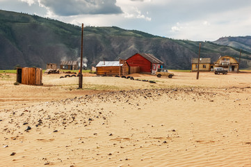 Isolated houses on sand, northern Mongolia