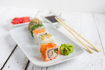 Sushi set on white wooden background